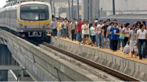 Ilustrasi Kereta Rel Listrik (KRL) (JAY DIRECTO / Getty Images)