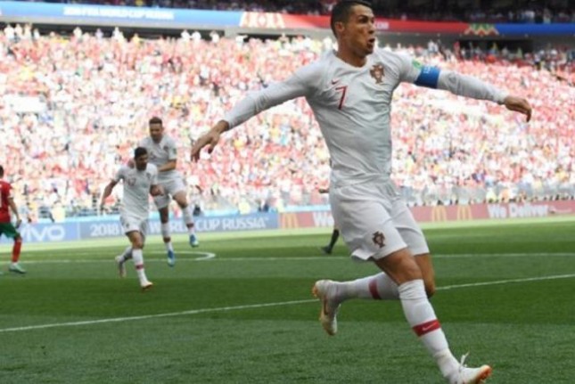 Kapten Portugal, Cristiano Ronaldo, merayakan gol sundulannya ke gawang Maroko pada pertandingan Grup B Piala Dunia 2018 di Stadion Luzhniki, 20 Juni 2018. 