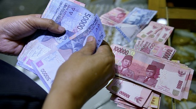 Ilustrasi uang Rupiah. (Bay Ismoyo/AFP)